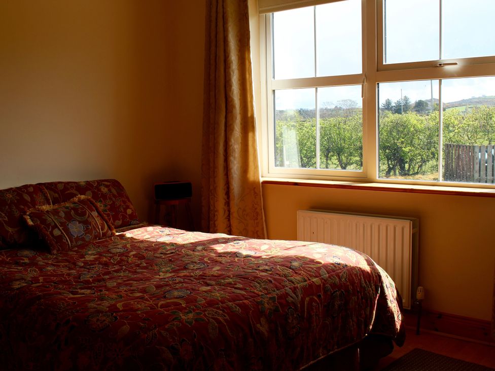 A bedroom with a bed and window at Welcome to the wild Atlantic way, Mulroy Bay