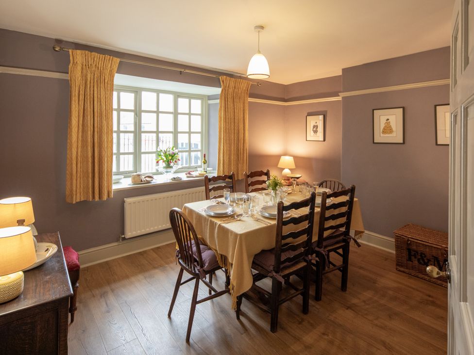 A dining room with a table set for dinner at Bishop Lightfoot Cottage Bishop Auckland