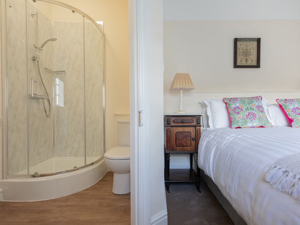 A bedroom with a shower and toilet at Bishop Lightfoot Cottage in Bishop Auckland