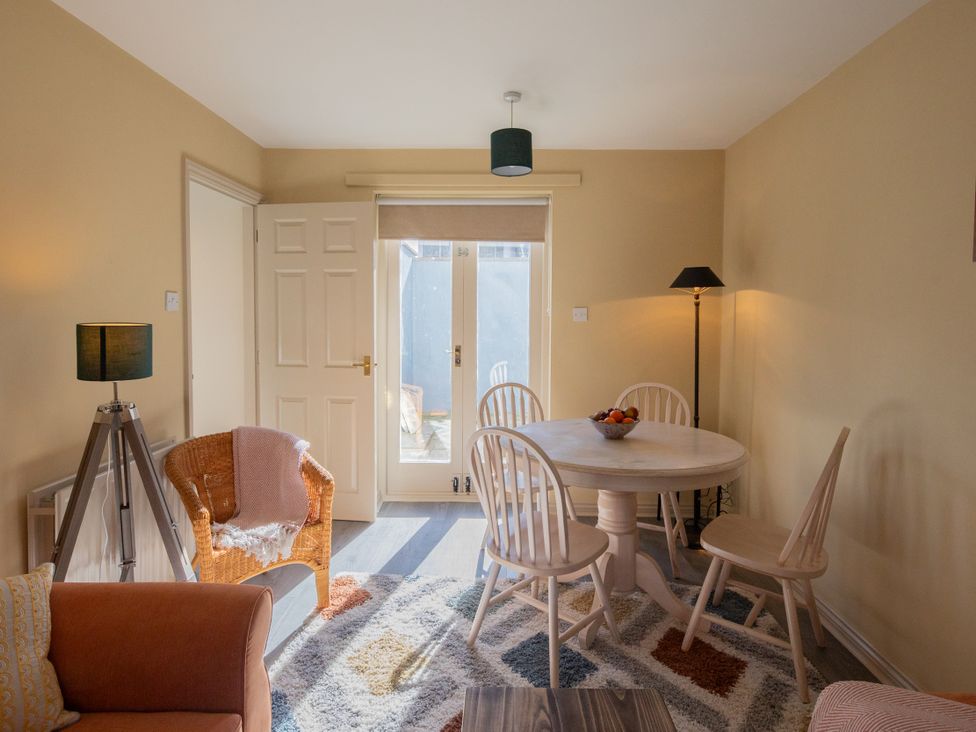 A dining room with a table and chairs at Sheriff's Tower Cottage - East in Bishop Auckland