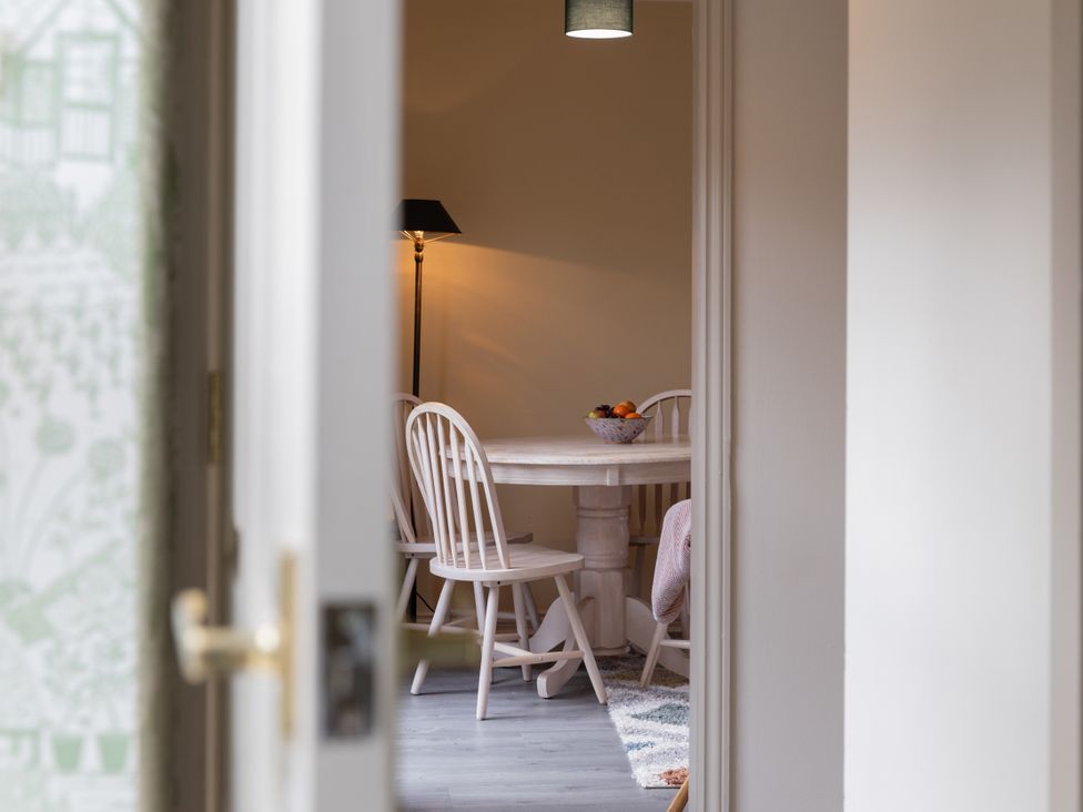 A dining room with a table and chairs at Sheriff's Tower Cottage - East in Bishop Auckland