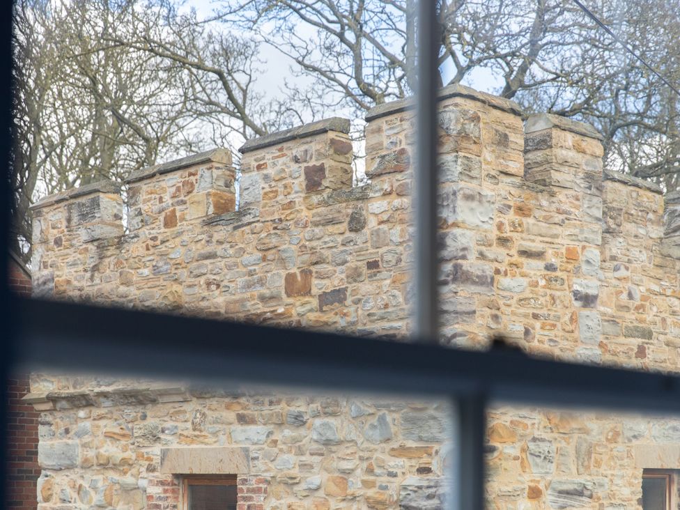 A stone wall viewed from a window at Sheriff's Tower Cottage - East Bishop Auckland