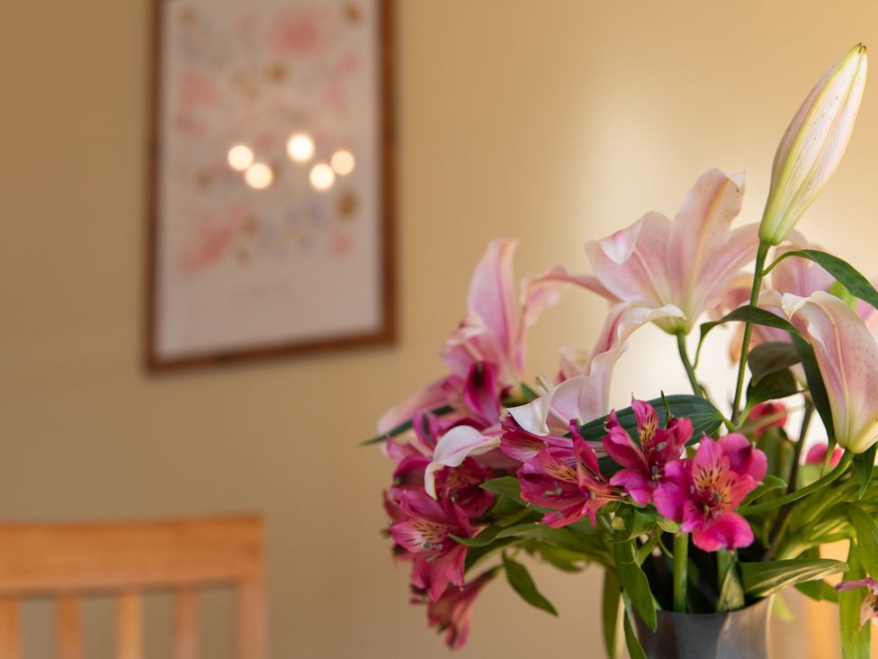 A flower arrangement on a table at Sheriff's Tower Cottage - West in Bishop Auckland