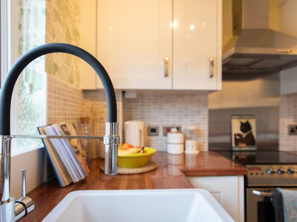 A kitchen with a sink and faucet at Sheriff's Tower Cottage - West in Bishop Auckland