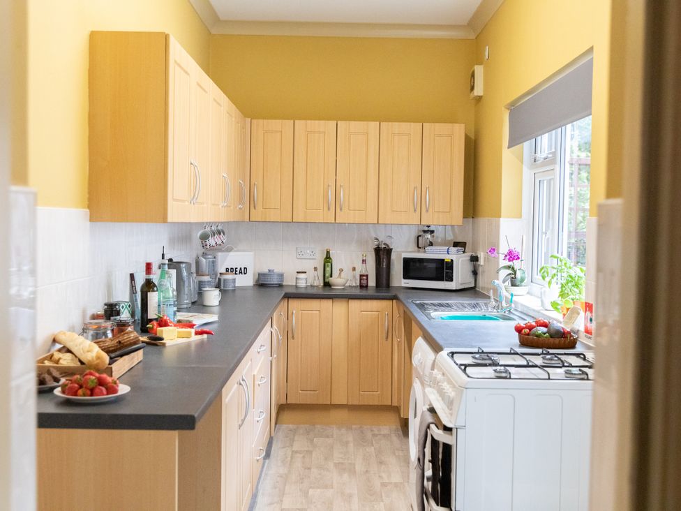 A kitchen with various appliances and items on the countertop at No 2 Townhouse in Bishop Auckland