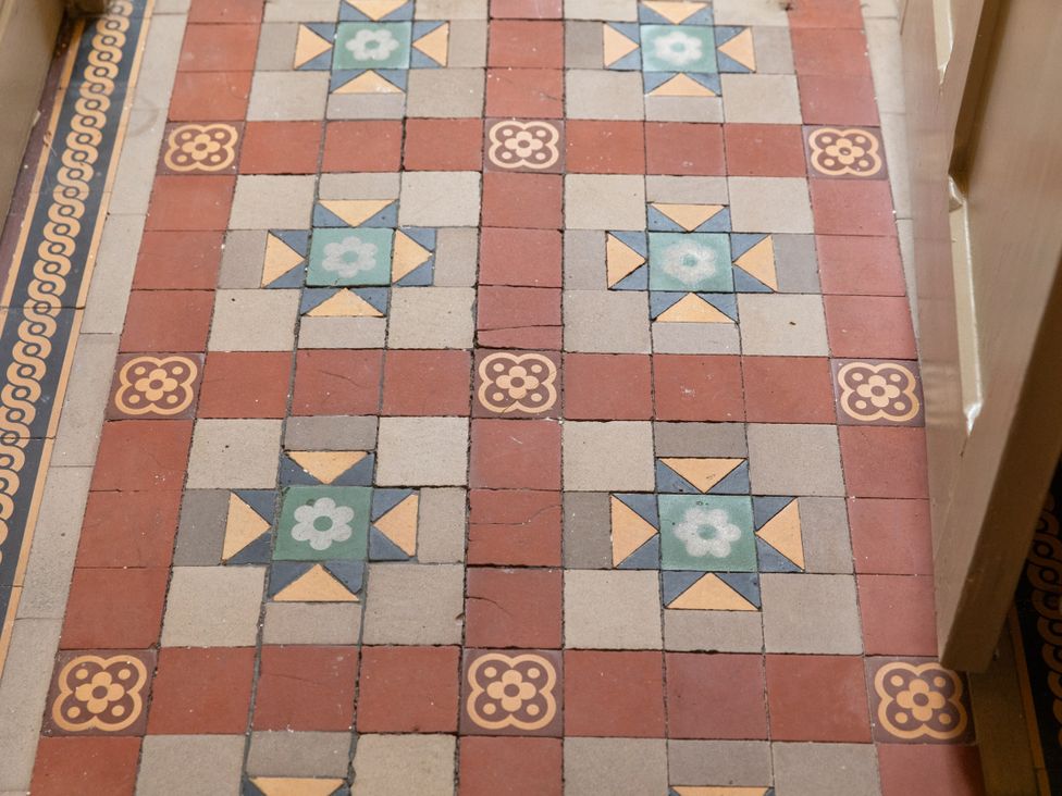 A patterned tiled floor in a hallway at No 2 Townhouse in Bishop Auckland