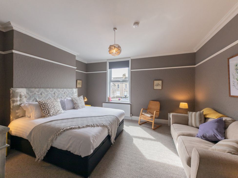 A bedroom with a double bed and a window at No 2 Townhouse, Bishop Auckland