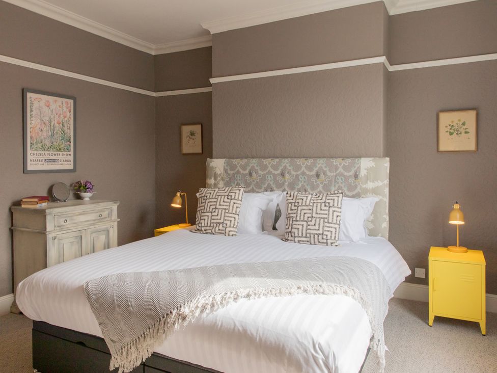 A bedroom with a bed and bedside table at No 2 Townhouse in Bishop Auckland