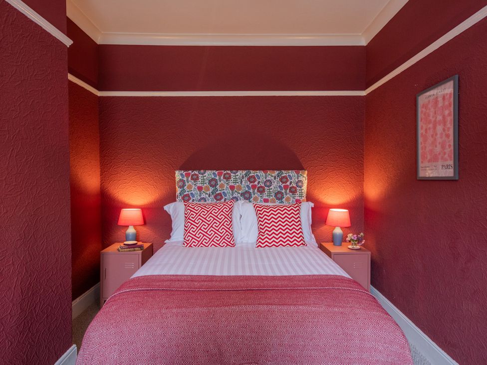 A bedroom with a bed and bedside tables at No 2 Townhouse in Bishop Auckland