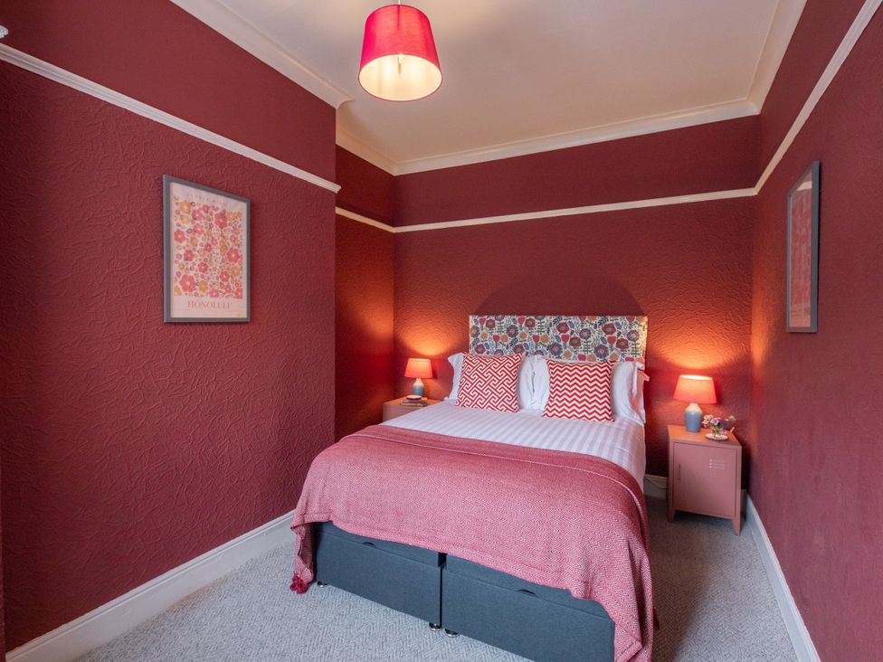 A bedroom with a bed and bedside tables at No 2 Townhouse in Bishop Auckland