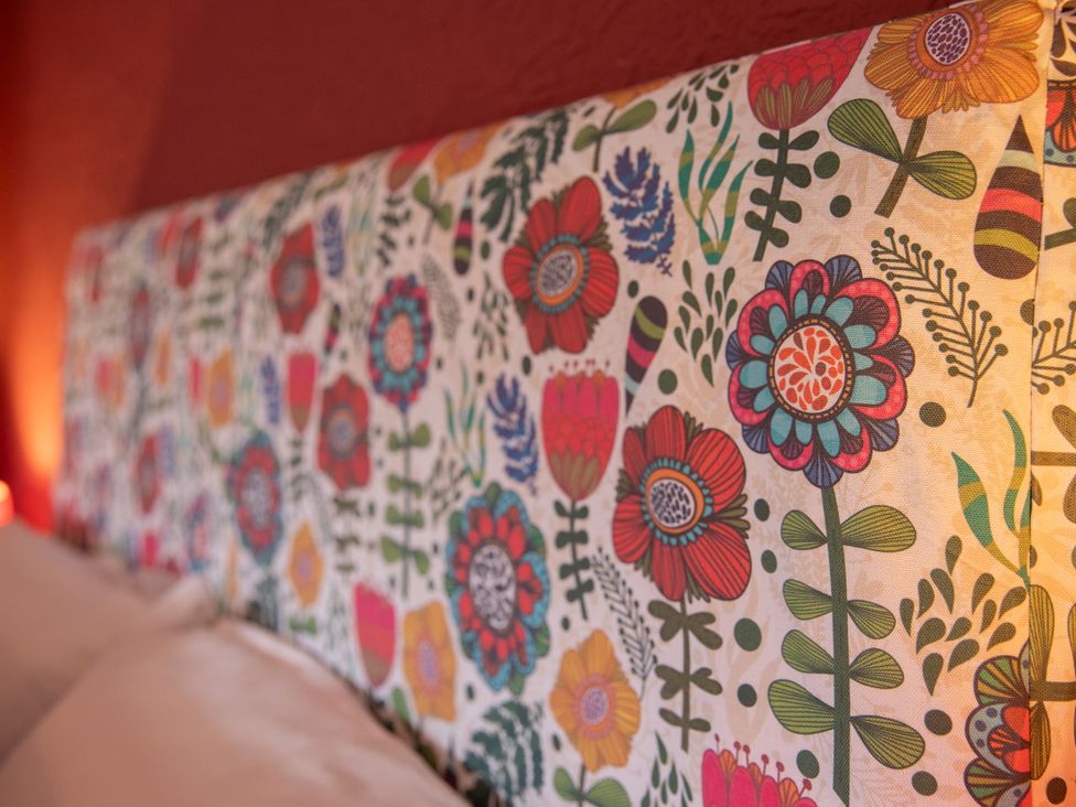 A headboard with floral pattern at No 2 Townhouse in Bishop Auckland