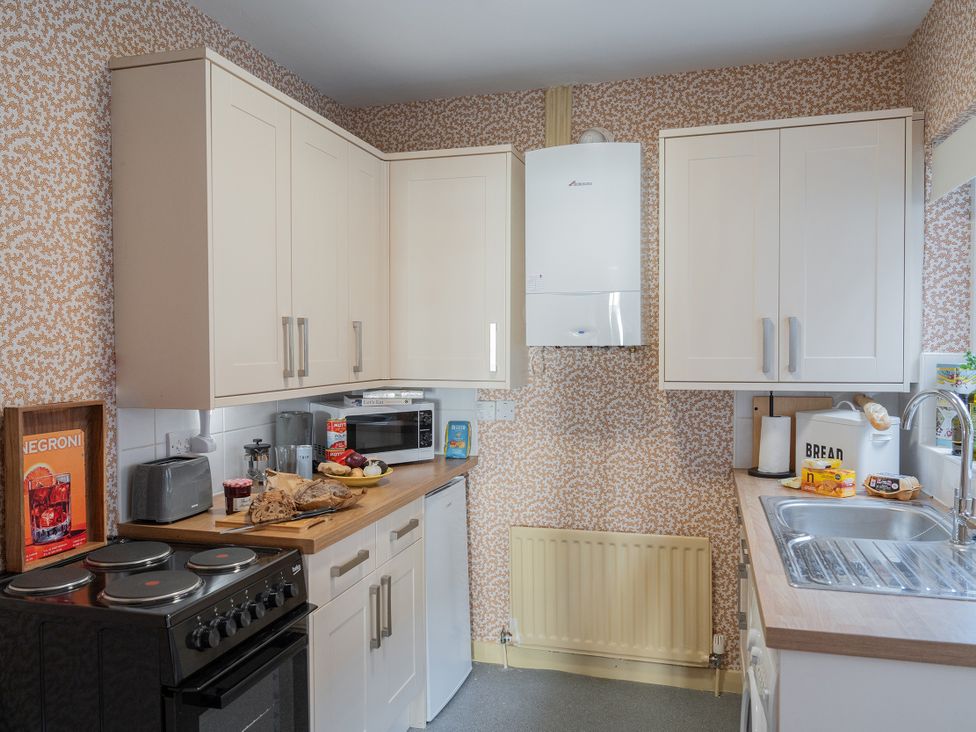 A kitchen with cabinets and appliances at No 4 Townhouse in Bishop Auckland
