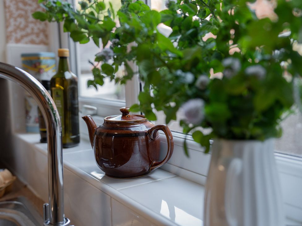 A teapot and plants on a windowsill at No 4 Townhouse in Bishop Auckland