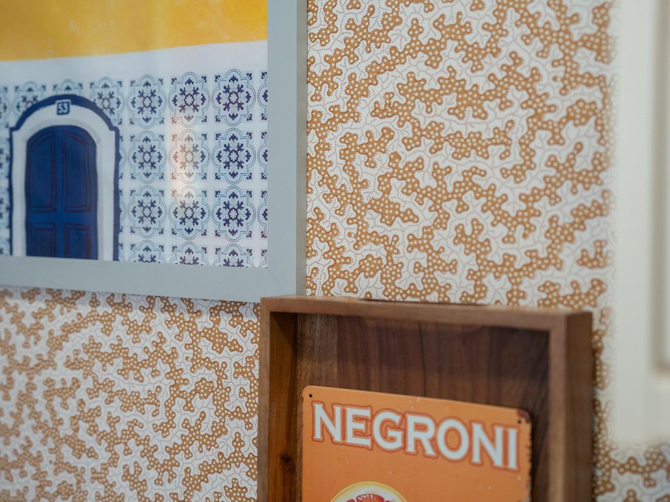 Wall with picture frame and a sign at No 4 Townhouse Bishop Auckland
