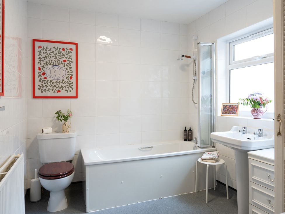 A bathroom with a bathtub and sink at No 4 Townhouse in Bishop Auckland