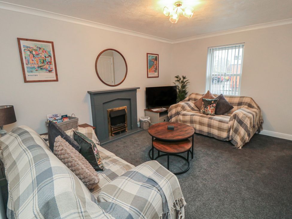 A living room with sofas and a coffee table at 3 Railway Terrace in Bridlington