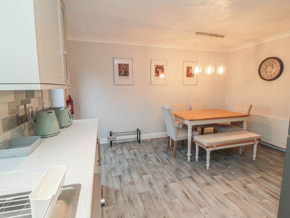 A dining room with a wooden table and chairs at 3 Railway Terrace in Bridlington
