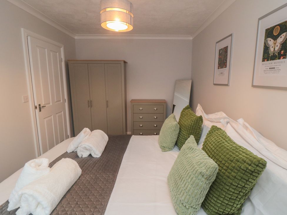 A bedroom with a bed and wardrobe at 3 Railway Terrace in Bridlington