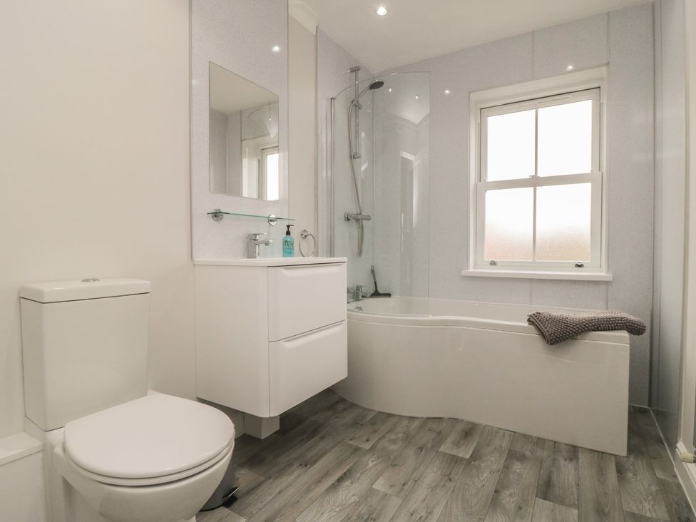A bathroom with a shower, bathtub, sink, and toilet at 3 Railway Terrace in Bridlington