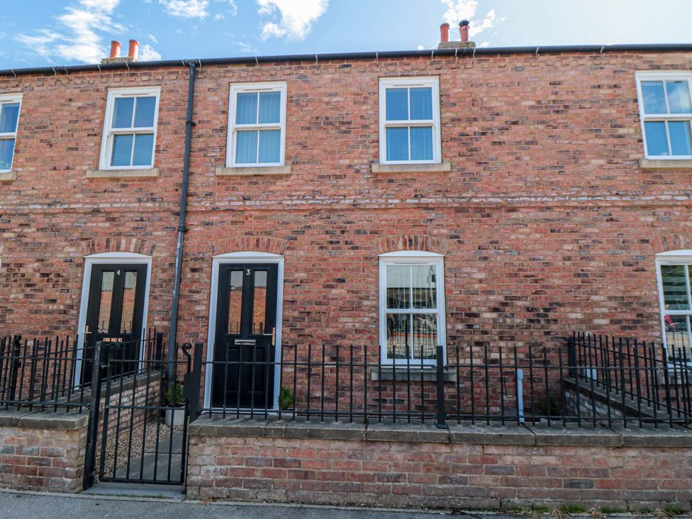 A brick facade with windows and doors at 3 Railway Terrace in Bridlington