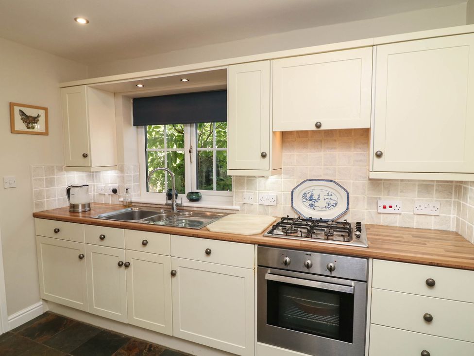 A kitchen with sink and oven at Wisteria House in Lincoln