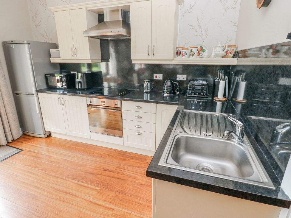 A kitchen with appliances and counters at Harvest Hill in Letterston