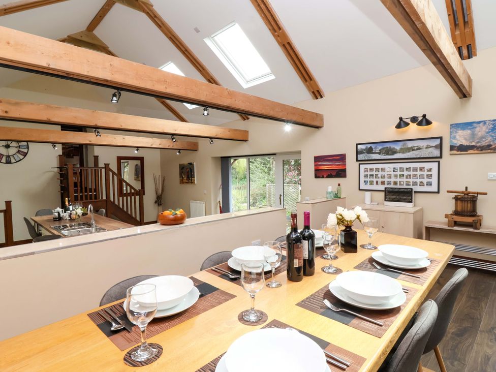 A dining room with a table set for dinner at Cider Press Cottage Torpoint