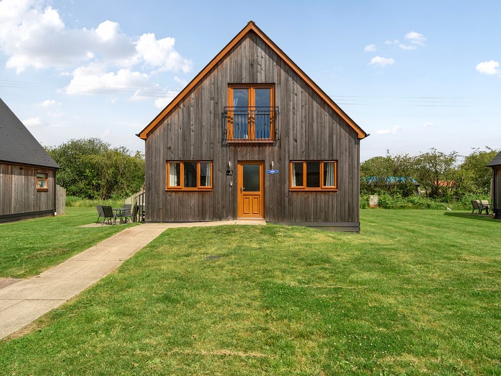 A house with windows and a door at Lodge 4 Near Brigg
