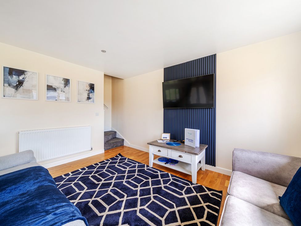A living room with a sofa and television at Lodge 4 Near Brigg