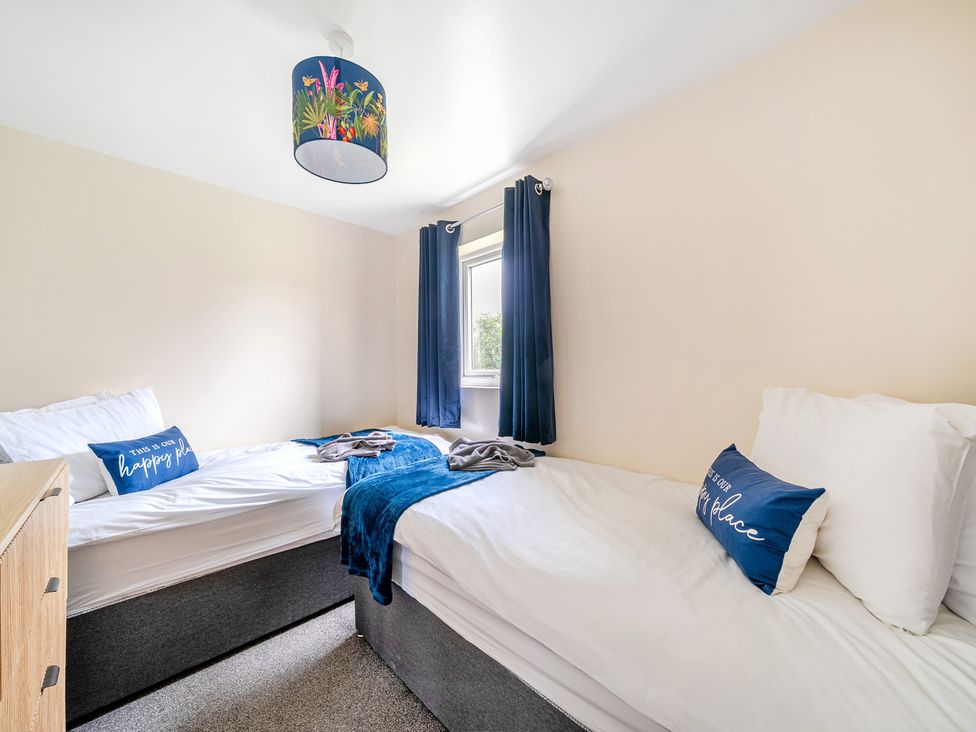 A bedroom with two beds and a window at Lodge 4 Near Brigg