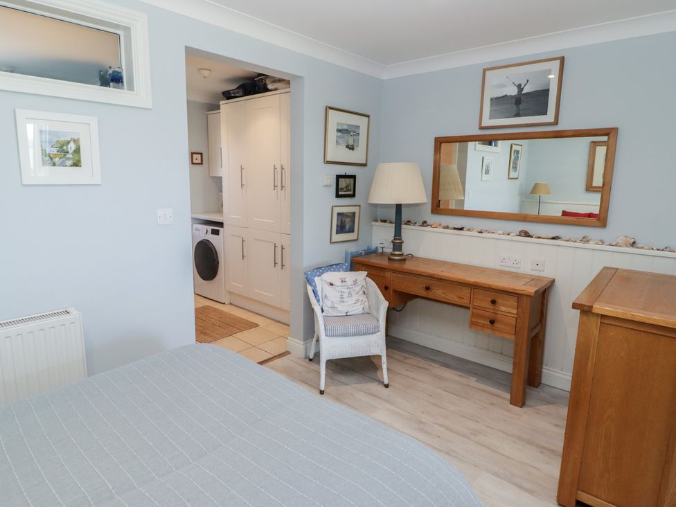 A bedroom with a bed and a desk at The Bolthole in Newport