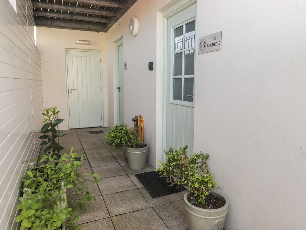 An outdoor entryway with doors and planters at The Bolthole in Newport