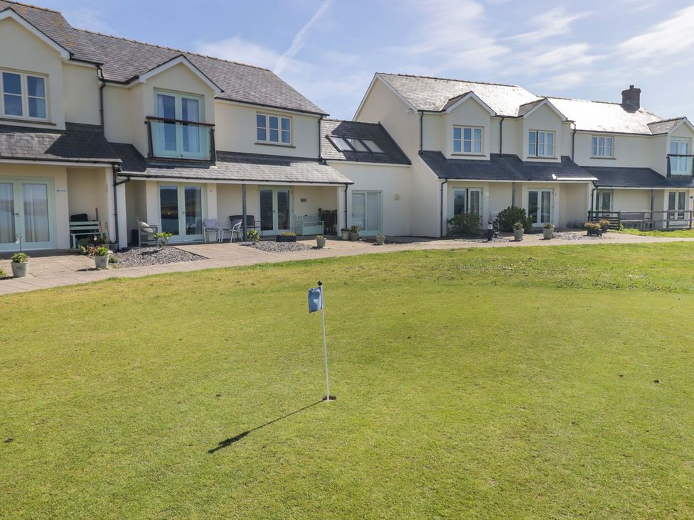 An outdoor area with houses and a golf flag at The Bolthole in Newport