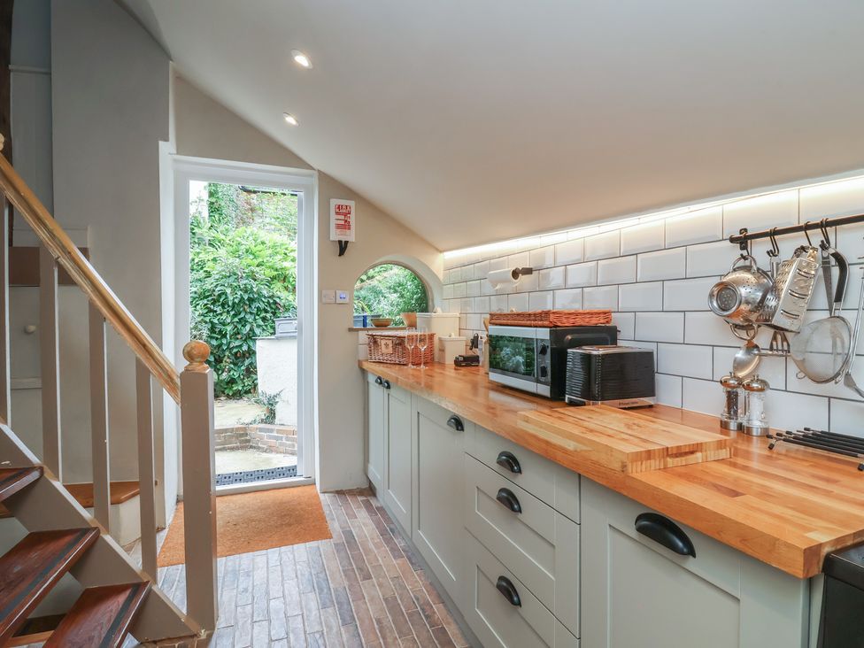 A kitchen with appliances and a countertop at The Bothy at Lewis Cottage in Spreyton