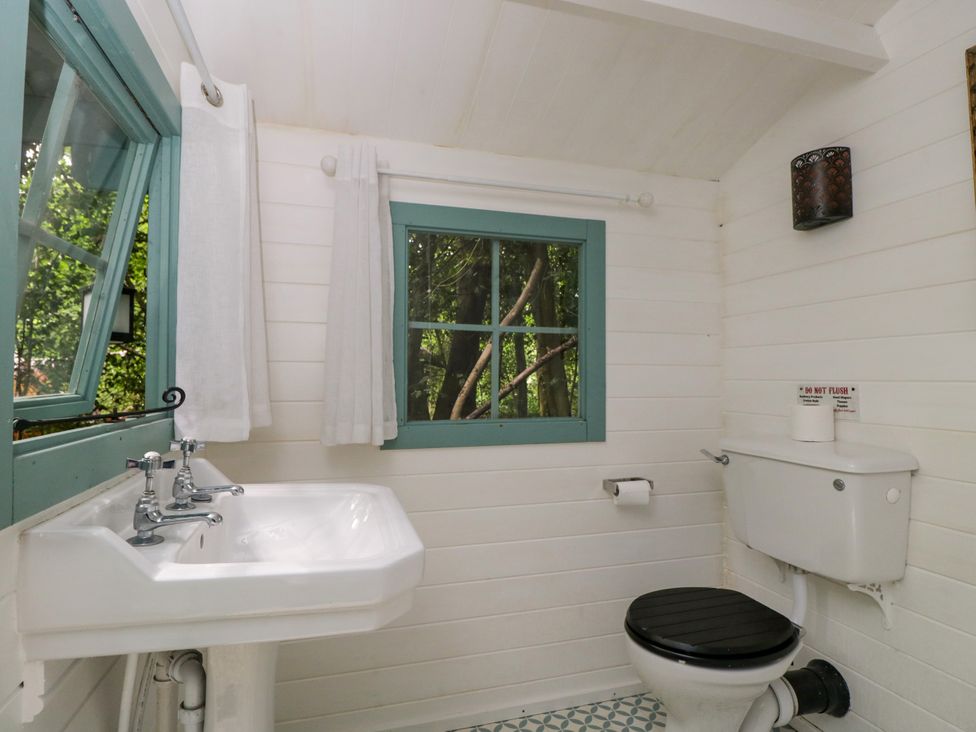 A bathroom with a sink and toilet at Bedouin Bell Tent, Woolton Hill