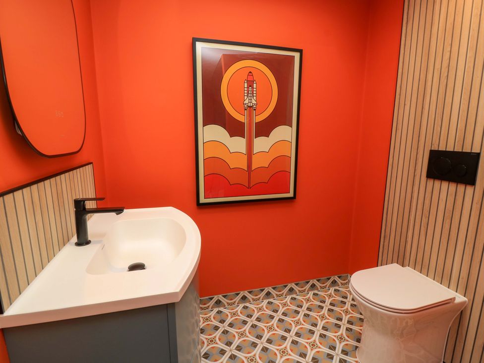 A bathroom with a sink and toilet at The Cozy Sow in Yeovil