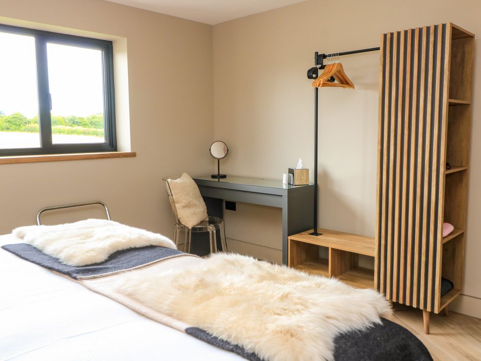 A bedroom with a desk and chair at The Cozie Sow in Galhampton