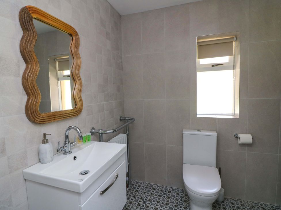 A bathroom with a sink and toilet at The Mews @ Derrybawn, Laragh, County Wicklow