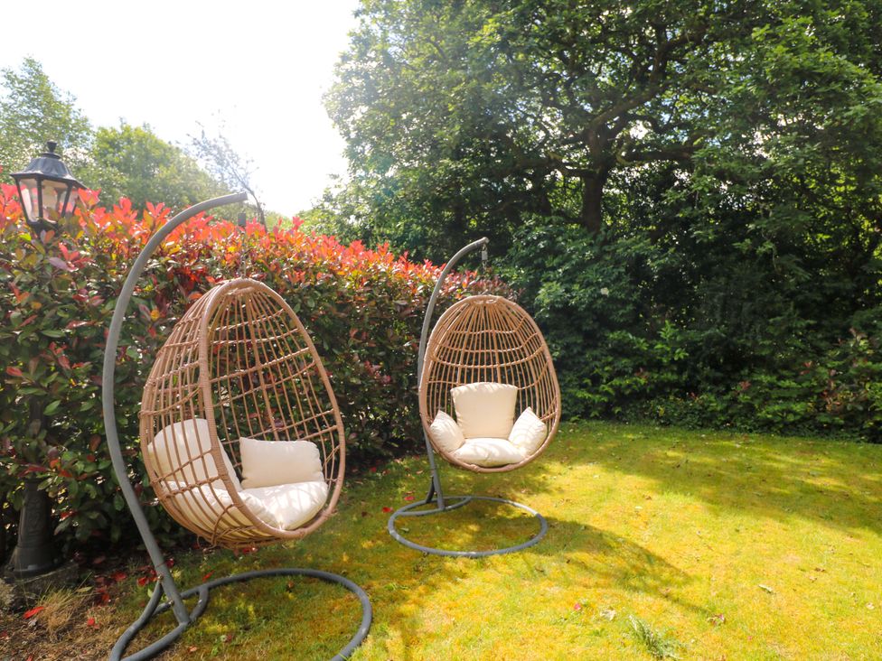 Two hanging chairs in a garden at The Mews @ Derrybawn, Laragh, County Wicklow