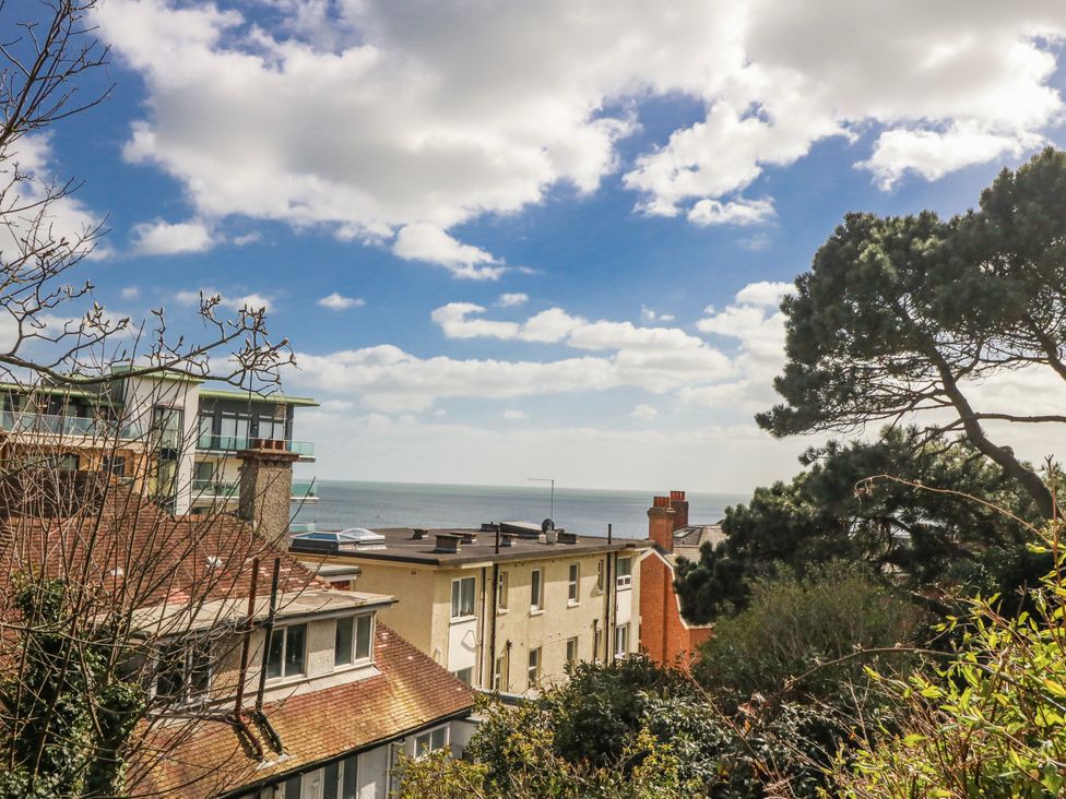 A view of the sea and buildings at Flat B in Bournemouth