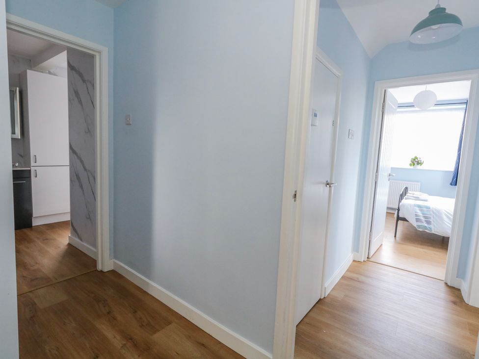 A hallway with a view into a bedroom at Flat B Bournemouth
