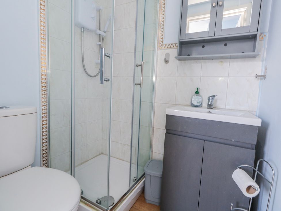 A bathroom with a shower and toilet at Flat B in Bournemouth