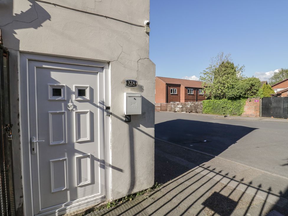 An entrance with a door and mailbox at 32A Cramp Hill in Darlaston