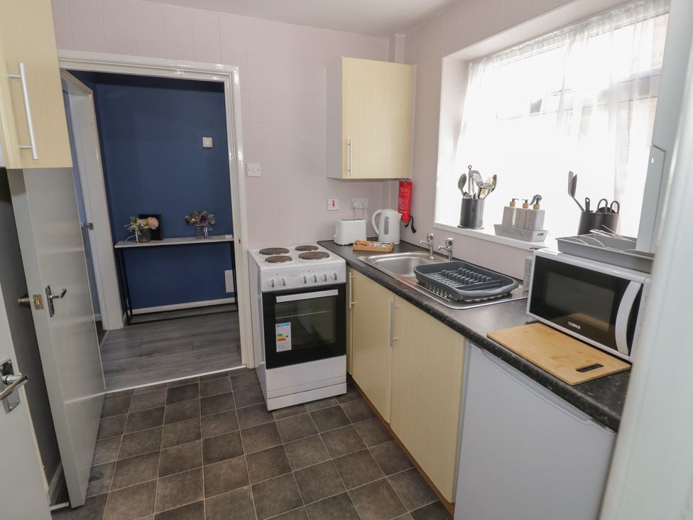 A kitchen with various appliances and fixtures at 32A Cramp Hill- 1 bed Darlaston