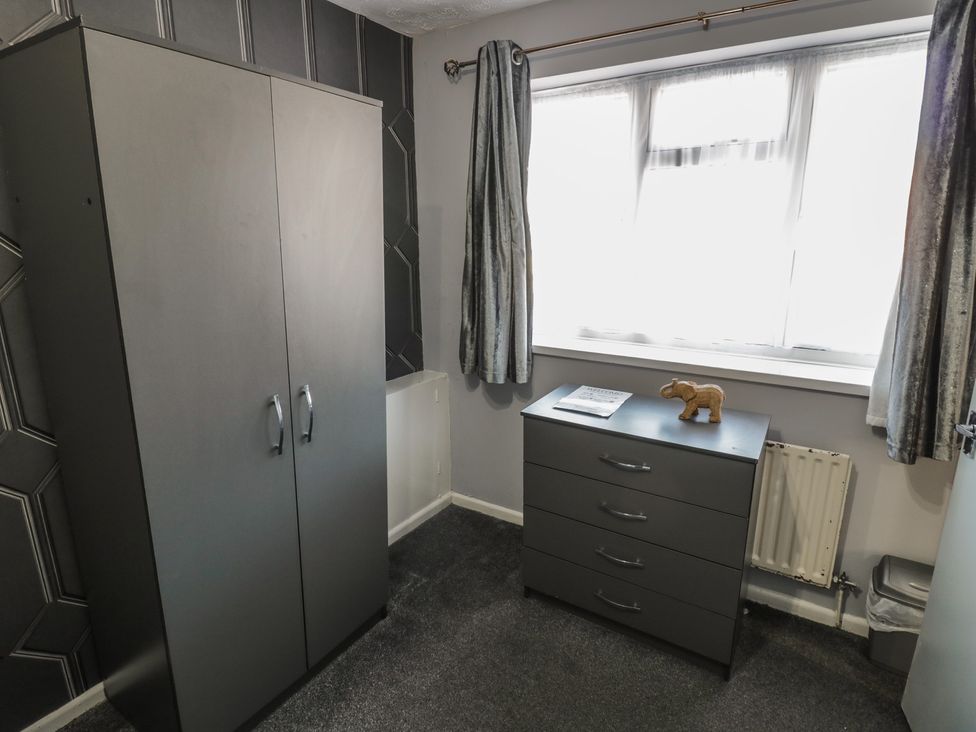 A bedroom with a wardrobe and drawer unit at 32A Cramp Hill- 1 bed Darlaston