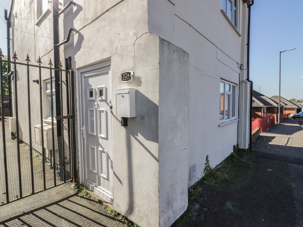An entrance with a door and mailbox at 32A Cramp Hill in Darlaston