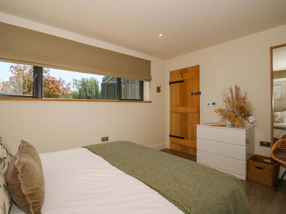 A bedroom with a bed and drawers at Thyme Away in Bucknell