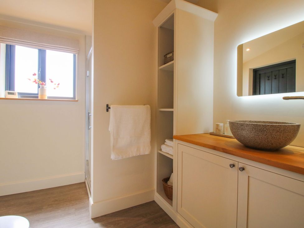 A bathroom with a sink and towels at Thyme Away in Bucknell
