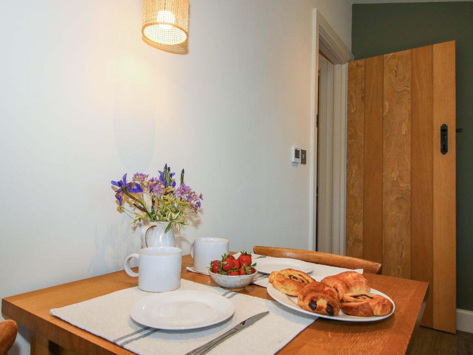 A dining room with a table set for breakfast at Thyme Away in Bucknell
