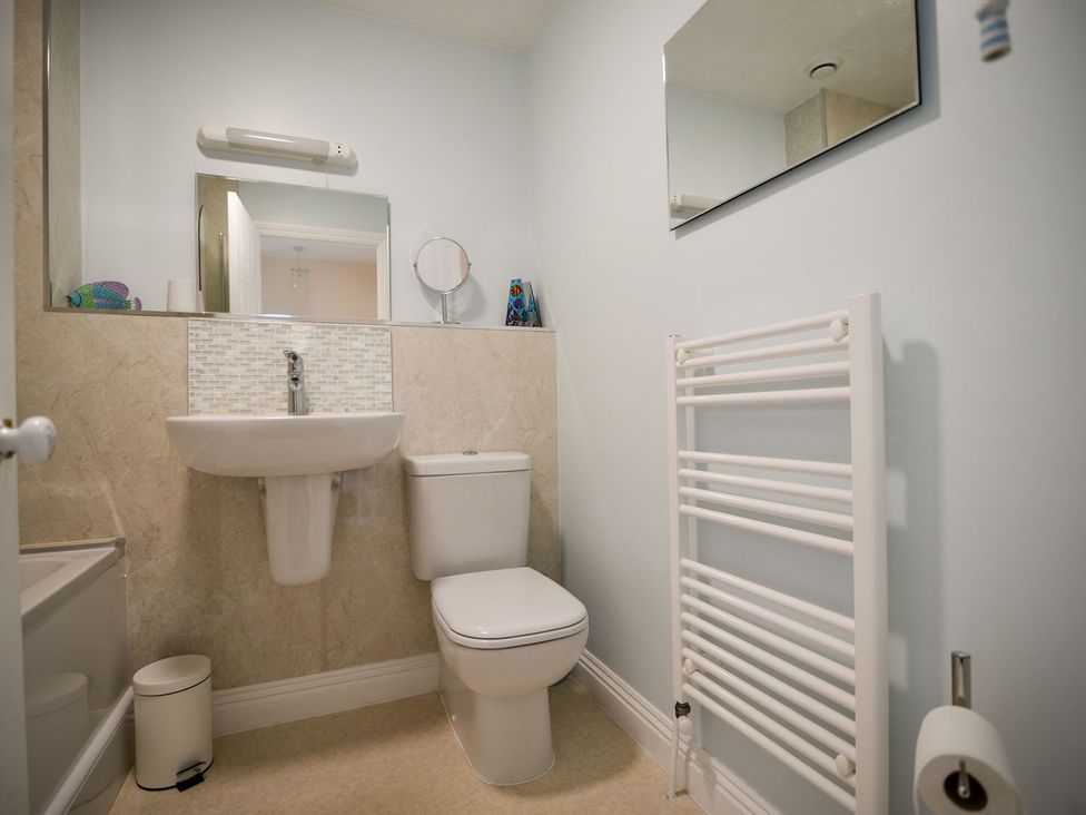 A bathroom with sink and toilet at Mead Cottage Bridport